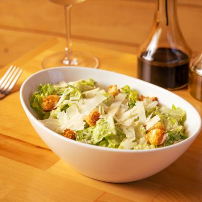 Caesar salad with croutons and shaved Parmesan.