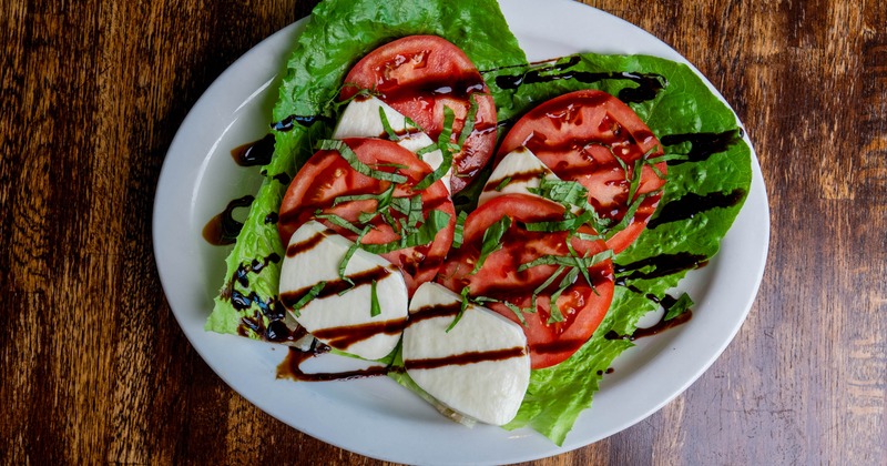 Caprese salad, served on the table