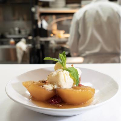 Poached pear with ice cream.