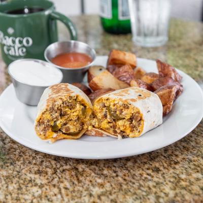 Breakfast burrito with scrambled eggs, sausage, roasted potatoes, and dipping sauces.
