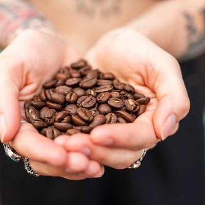 Holding coffee beans.