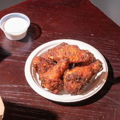 Lemon Pepper Wings and dipping sauce.