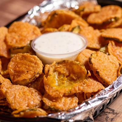 Fried pickles served with a dip.