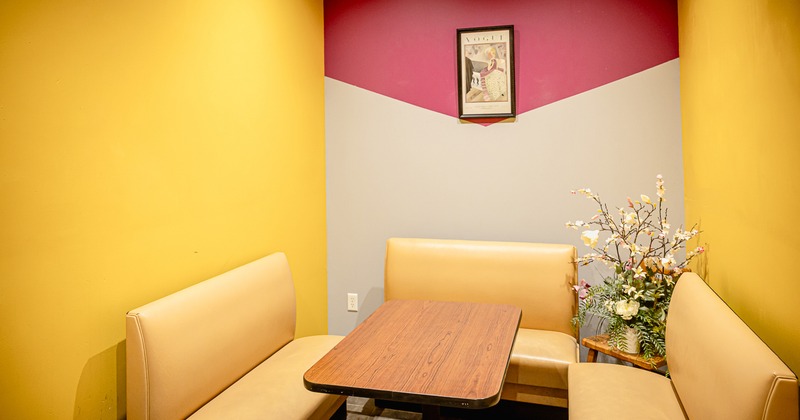 Cozy restaurant booth seating area designed for small groups or intimate dining