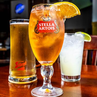 A glass and a mug of beer, and a Margarita cocktail.