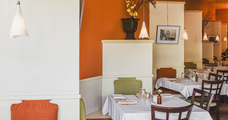 Interior, bright seating area, tables ready for guests