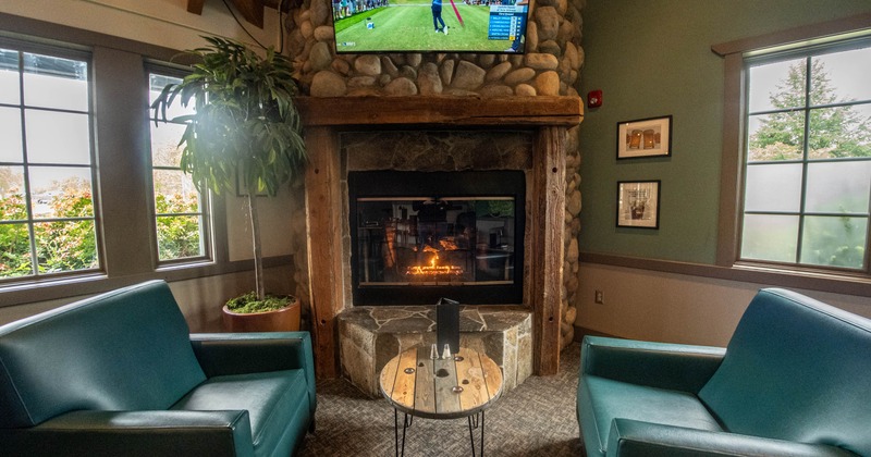 Interior, two armchairs in front of a fire pit