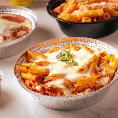 Baked ziti served with lasagna and spicy vodka rigatoni.
