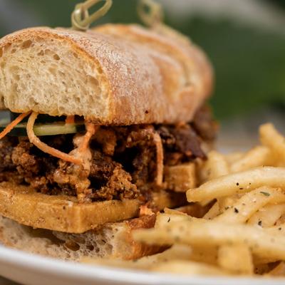 Hot fried chicken sandwich with seasoned fries.