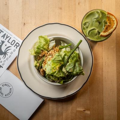 Butter lettuce and asparagus salad, accompanied by iced matcha.