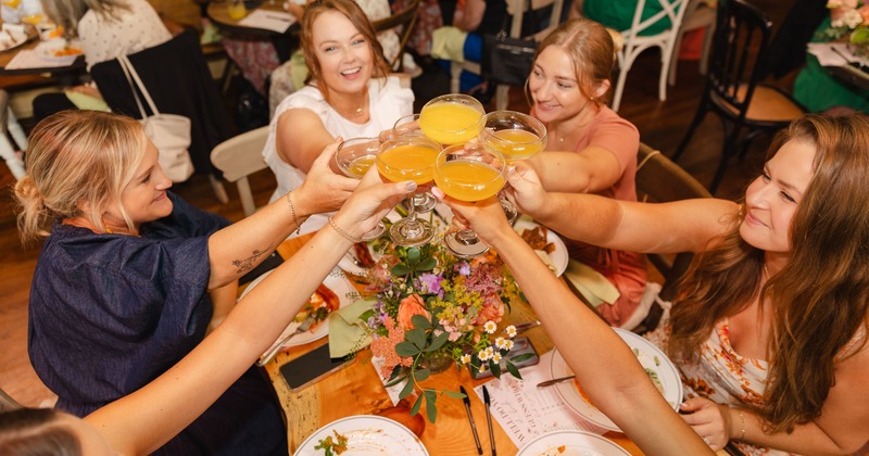 Hands toasting with drinks
