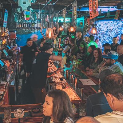Interior, bar, staff in action, guests enjoying drinks