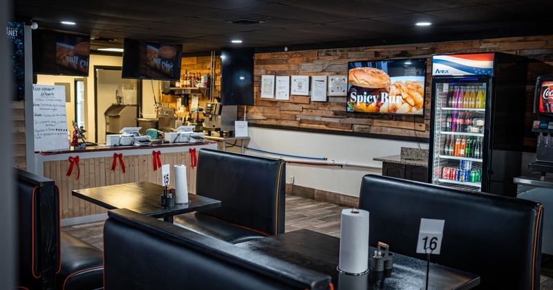 Food counter behind the tables and chairs