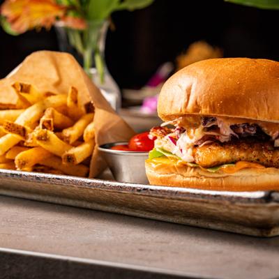 Beef patty, pork belly jam in Asian BBQ sauce, lettuce, pepper jack, fries.