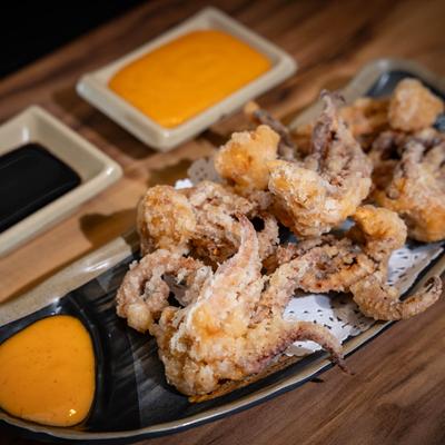 Deep fried squid legs with sauces.