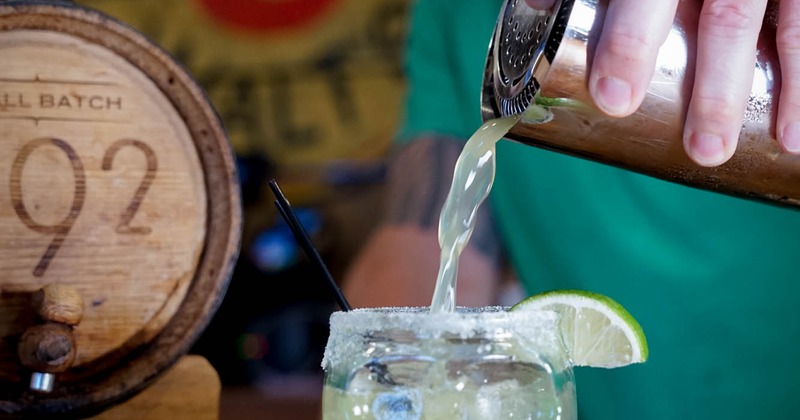 Owner  pouring a cocktail
