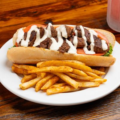 Tenderloin po' boy sandwich with fries.