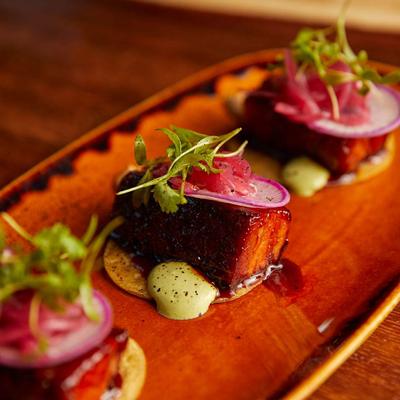 Glazed pork belly bites.