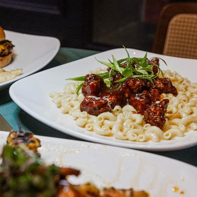 Mac and cheese topped with barbecue chicken bites.