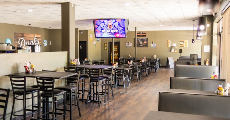Interior, high tables and chairs in dining area