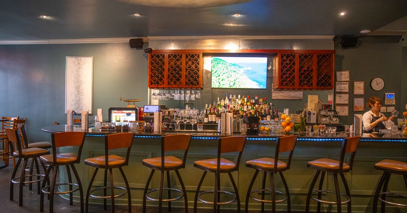 Interior, bar, chairs, tv above, front view