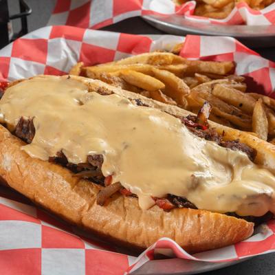 Prime rib-eye Philly sandwich, served with fries