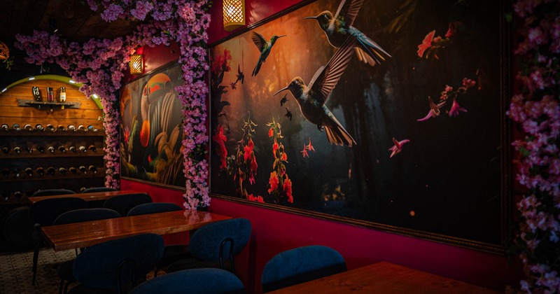 Interior seating area with chairs and tables, floral decoration