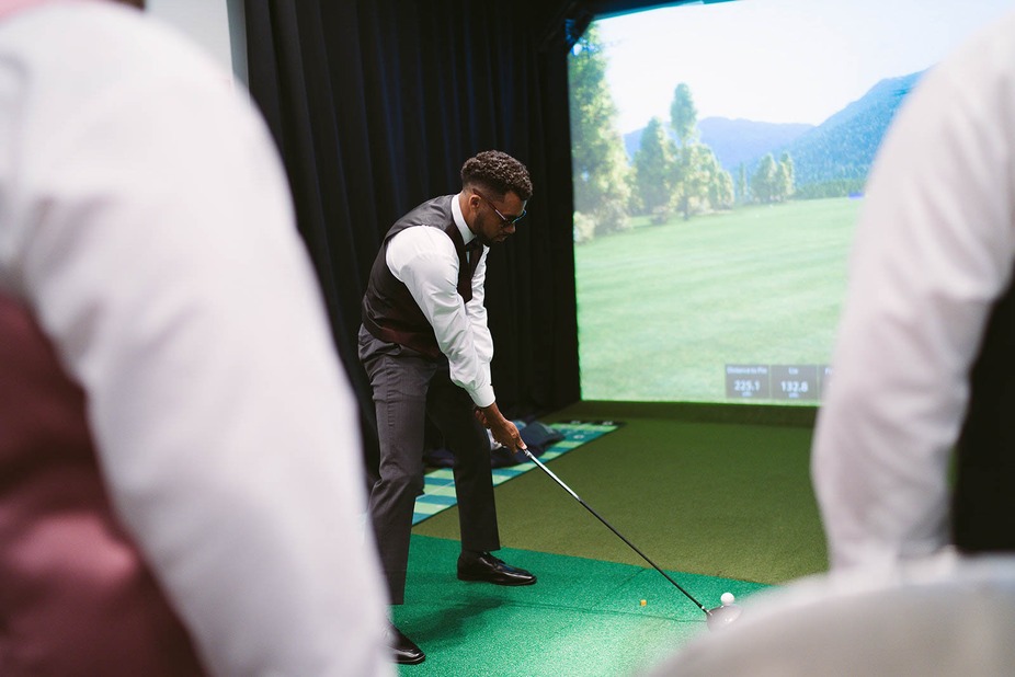Guest playing a game of virtual golf