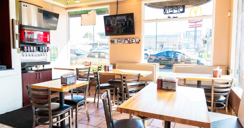 Diner area, tables and chairs, tv above