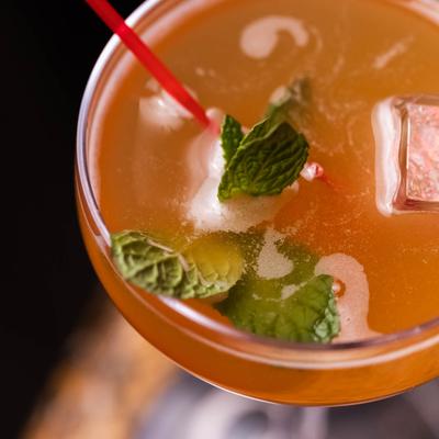 Craft cocktail in a coupe glass, top view.