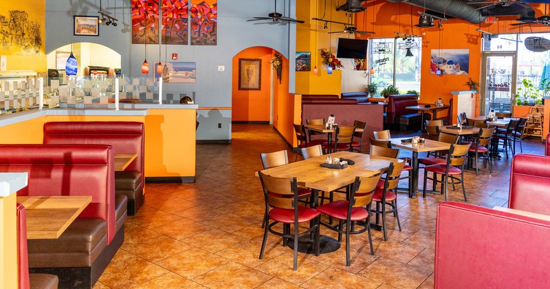 Interior, spacious dining area with tables and chairs