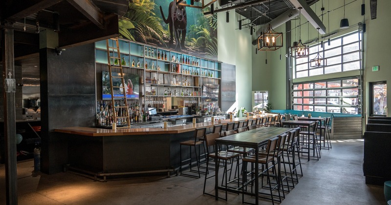 Modern, industrial style restaurant interior, bar and seating area