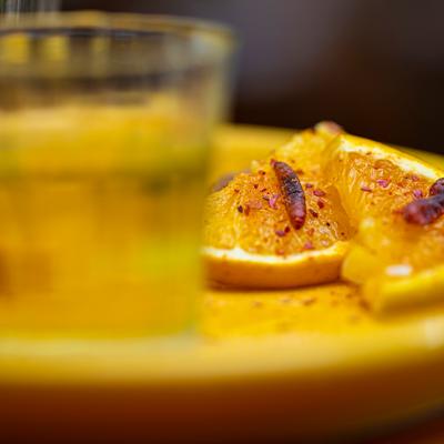 A closeup on a drink and a meal.