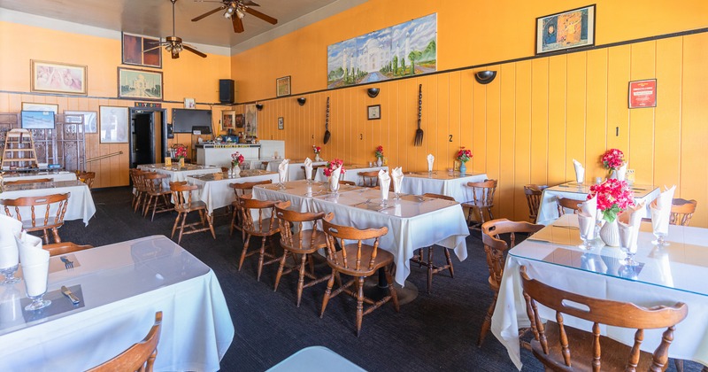 Spacious interior dining area with set tables ready for guests
