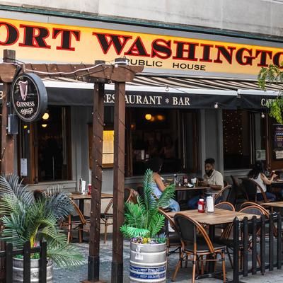 Exterior with signage and outdoor seating.