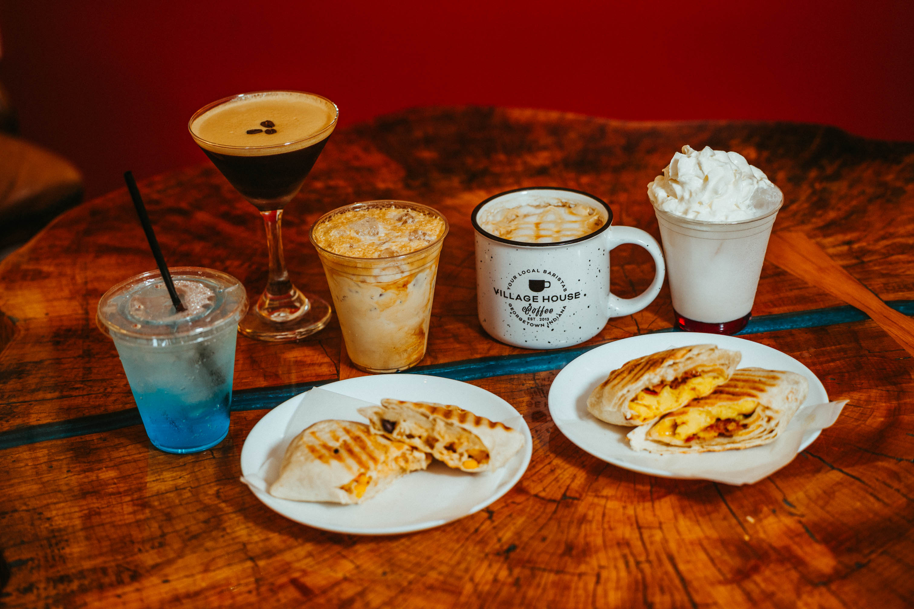 Breakfast wrap and chicken wrap served with cocktails and coffee beverages