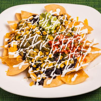 Fiesta Nachos with black beans, pico de gallo, jalapenos, sour cream and guacamole.