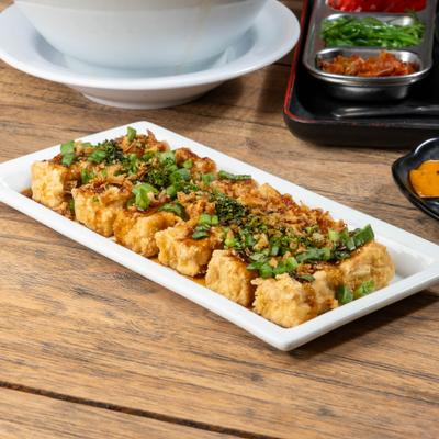 Fried Tofu Steak with homemade yum yum sauce, green onion and fried onion.