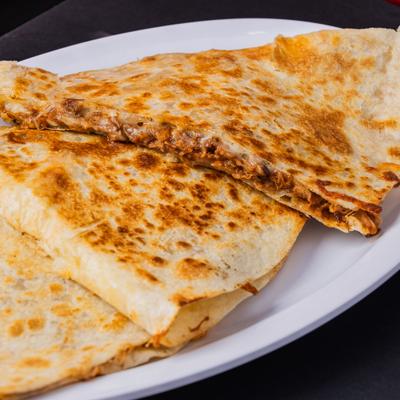 Quesadilla Birria served on the plate, close view.