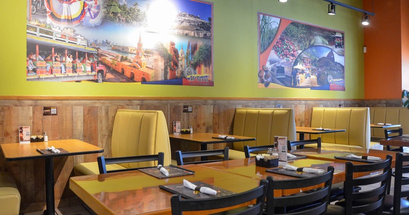 Interior, dining area with tables, chairs and restaurant booths