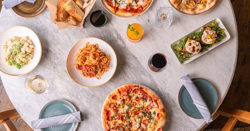 Overhead view of a table full of dishes and drinks