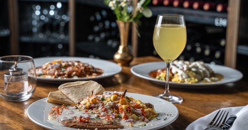 Interior, dining area with fire place in the back