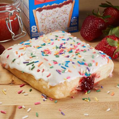 Strawberry pop tart with strawberry filling, vanilla glaze, and colorful sprinkles.
