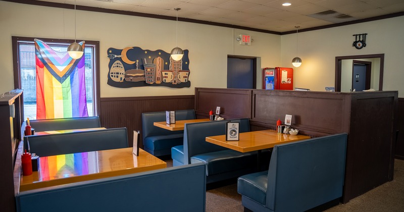 Cozy interior seating area with upholstered booths
