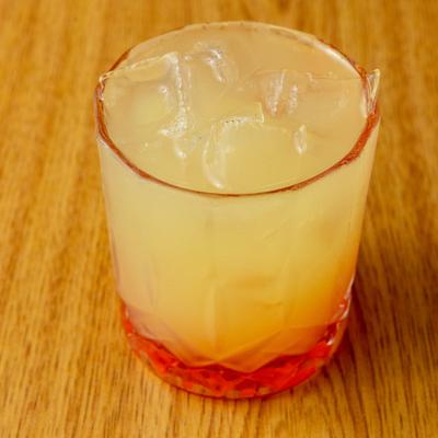 Tequila Sunrise cocktail served in a rocks glass.