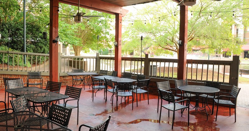 Roof covered patio, tables and seats