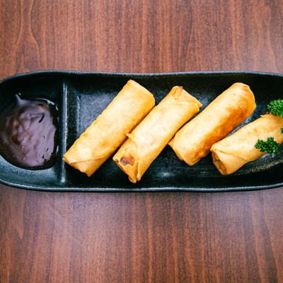 Spring rolls with dipping sauce.