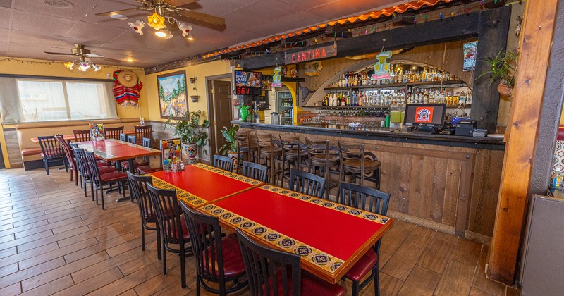 Interior space, two dining tables near the bar