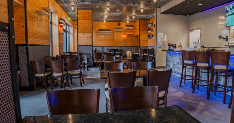 Interior, wide view of seating area, bar area on the right