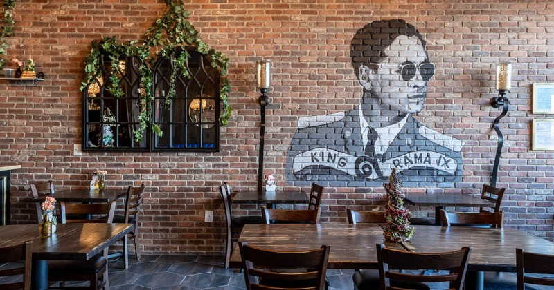 Dining area with mural on wall